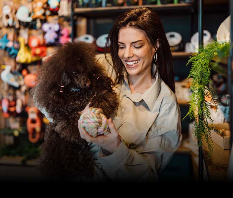 Female artist sketching with pencil in art studio, focused on creating detailed artwork.